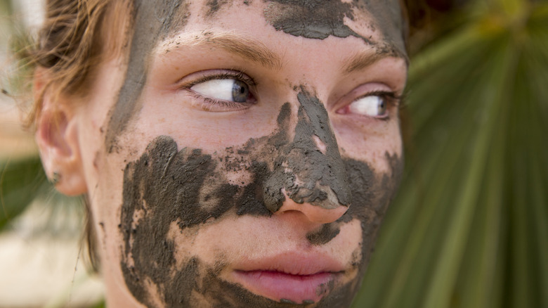 Woman wearing a mud mask