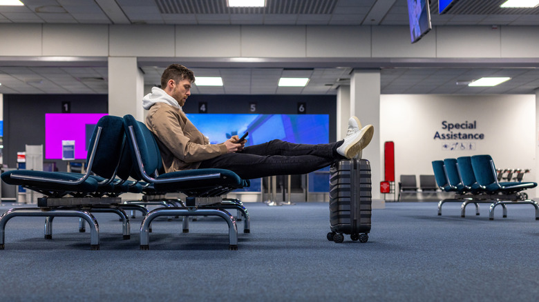 Man waiting alone at the gate