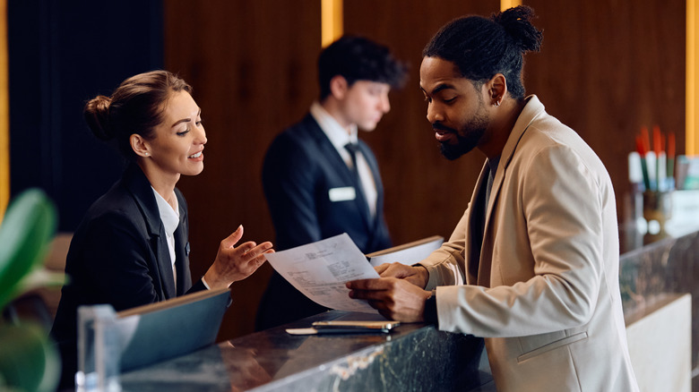 Man checking into a hotel