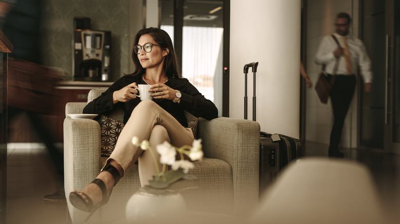 Woman relaxing in an airport lounge