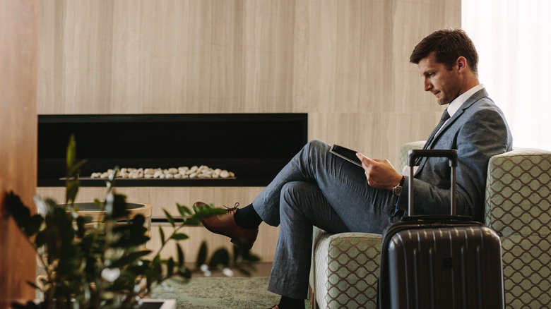 Man relaxing in an airport lounge