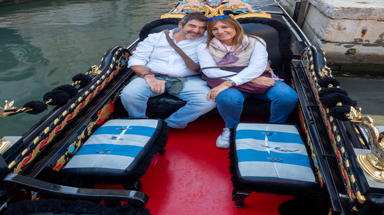 Couple smiling while enjoying a gondola ride