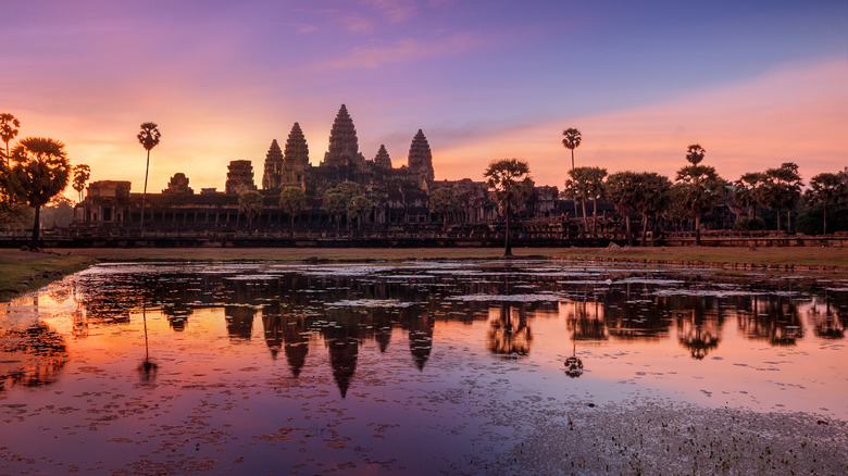 Angkor Wat reflecting of water at sunset.