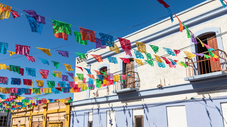 A building and banners in Todos Santos