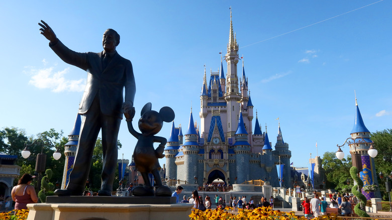 Disney and Mickey in front of castle