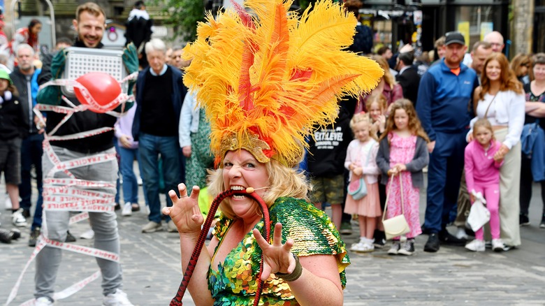 Street performers posing with audience