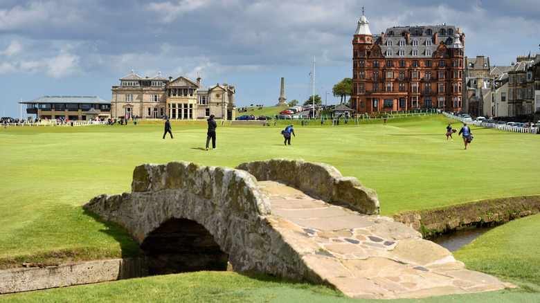 Golfers walking on Old Course