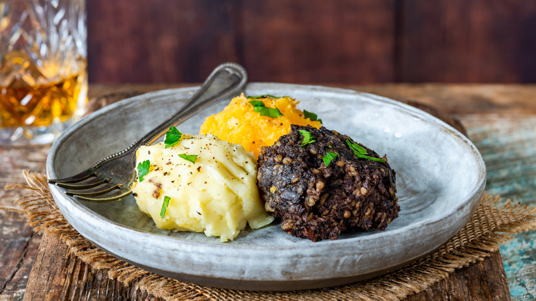 Haggis, neeps, and tatties on plate