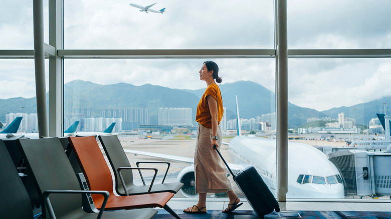 Woman walking through airport