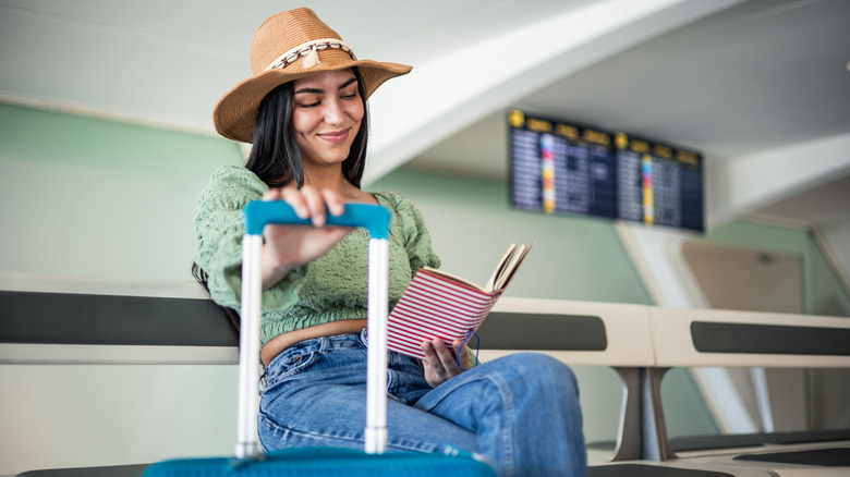 Person reading at airport