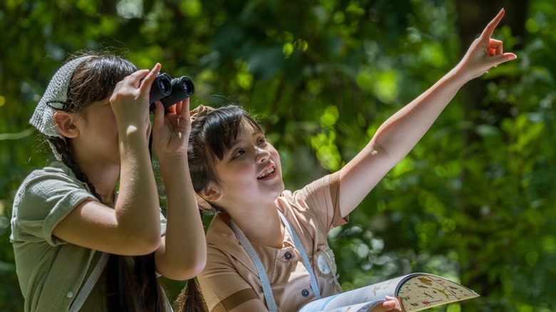 Two girls with binoculars