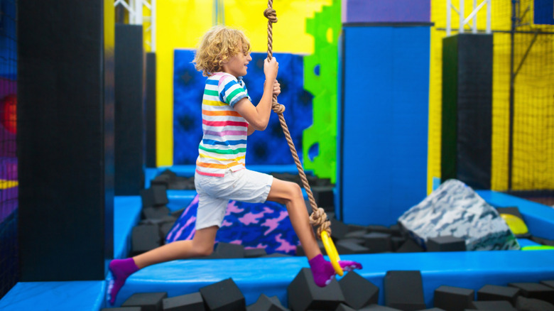 Child plays on a rope