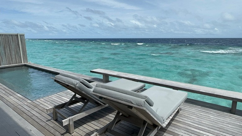 lounge chairs near Maldives water