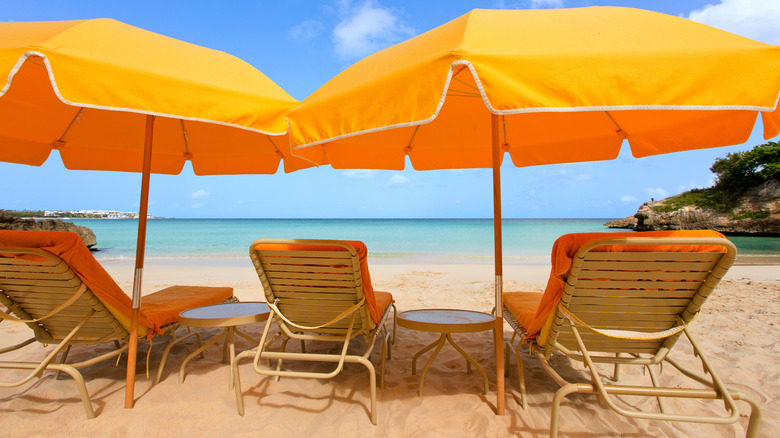 yellow umbrellas, chairs on beach