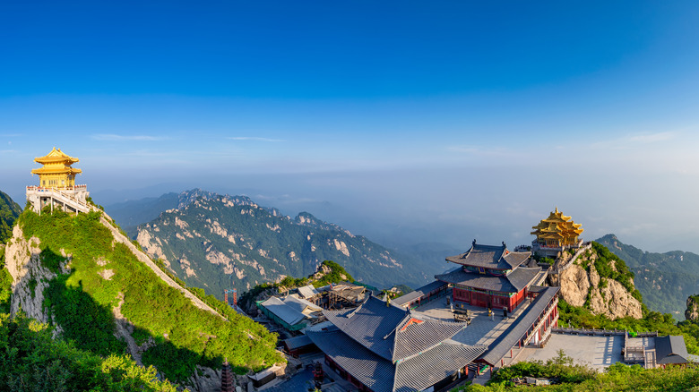 Golden Temple of Laojun Mountain against a blue sky