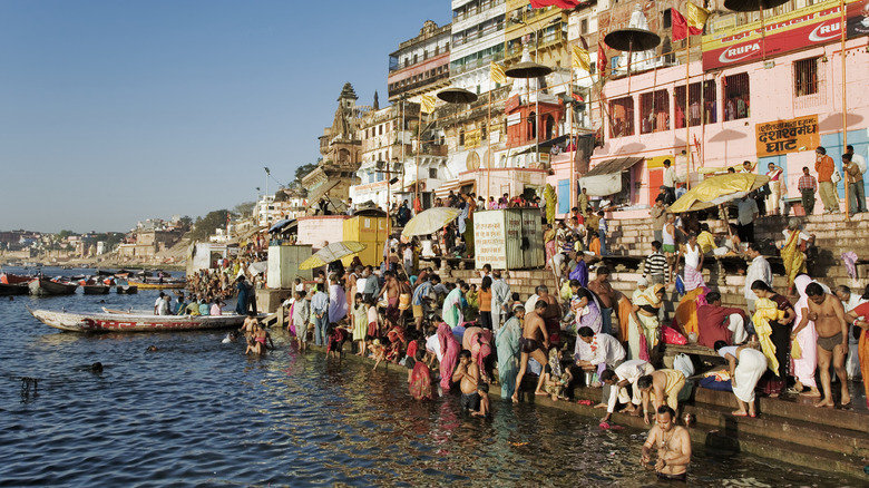 People bathing in the sacred River Ganges, India.