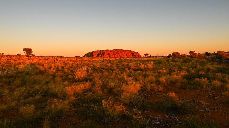 Ayers Rock against a blue sky in Australia.