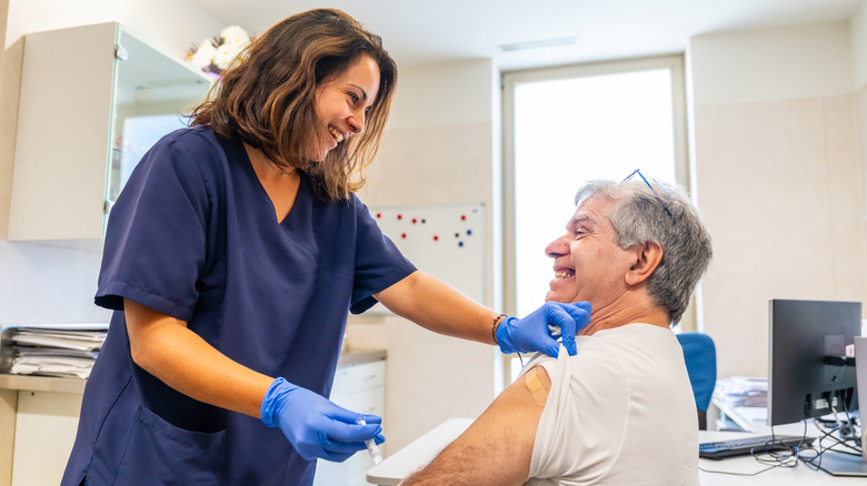 nurse giving vaccine