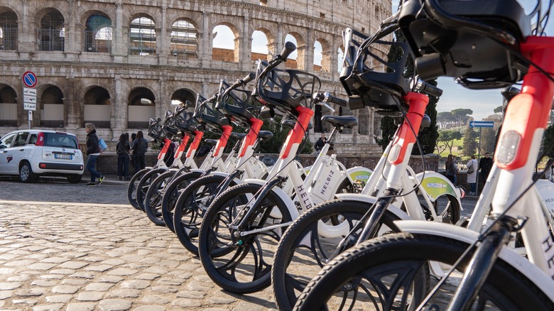 Rome Colosseum with row of e-bikes