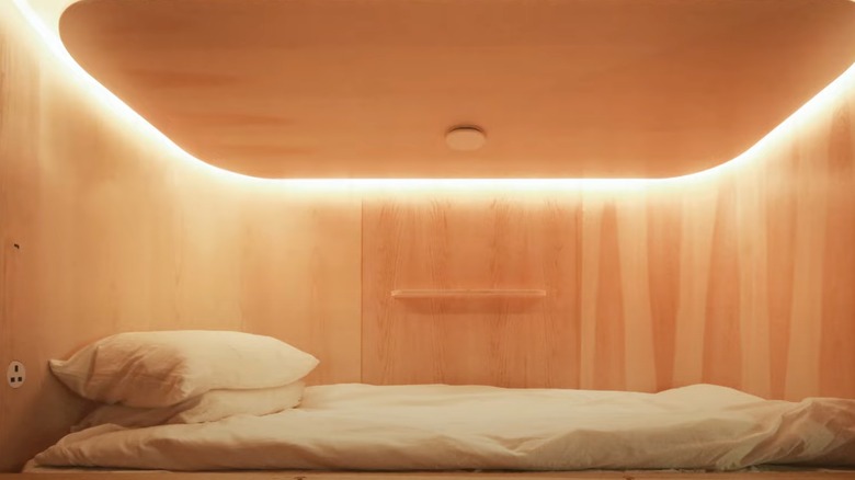 Minimalist capsule with wooden walls at Sleeep, Hong Kong