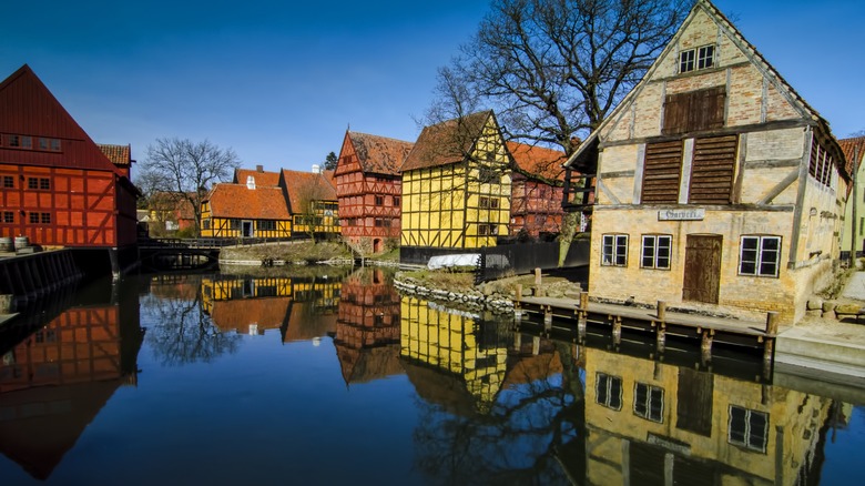 Old buildings reflected in water