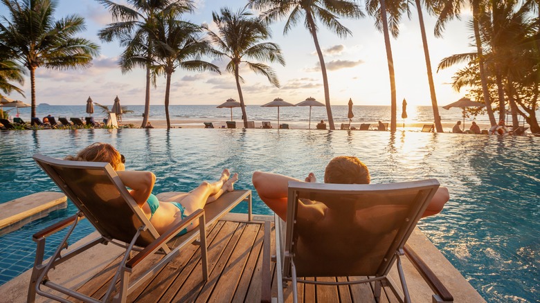 couple by pool at a resort