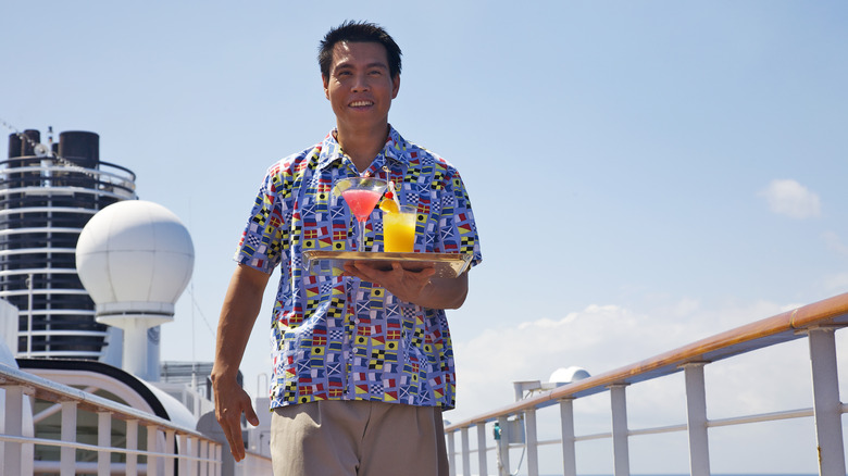 Cruise ship waiter bringing drinks