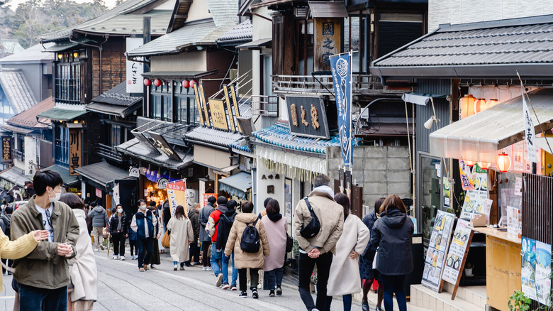 People walk down Omotesando Road in Narita, Japan