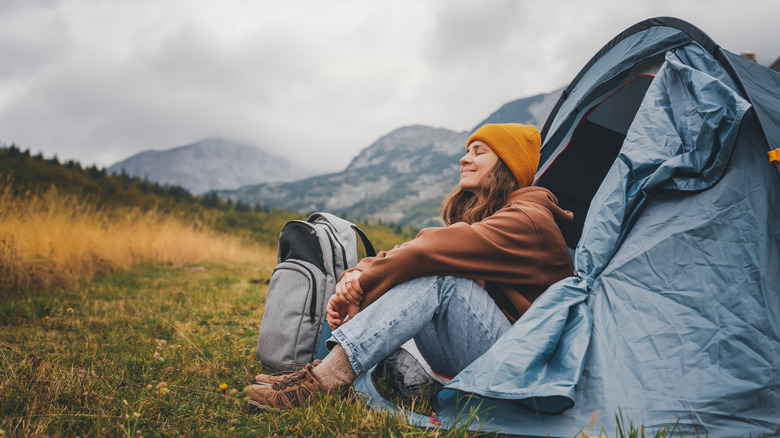 Woman relaxing in tent