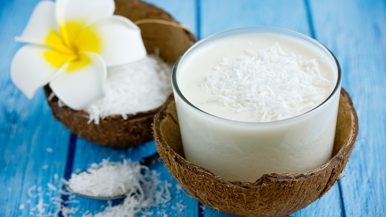 creamy white cocktail in coconut