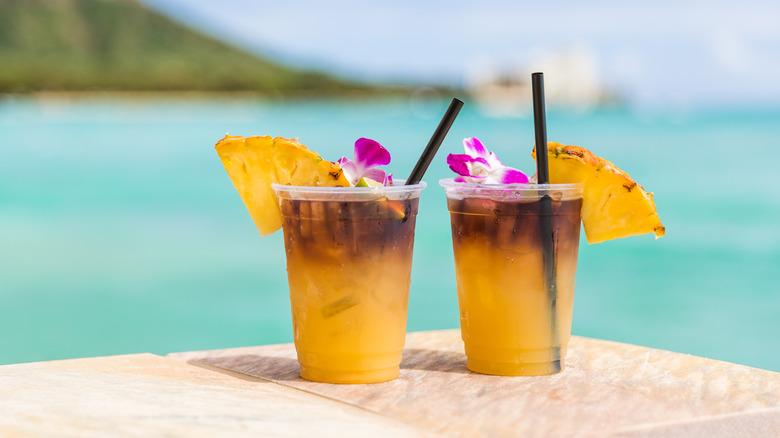 two mai tais on beach