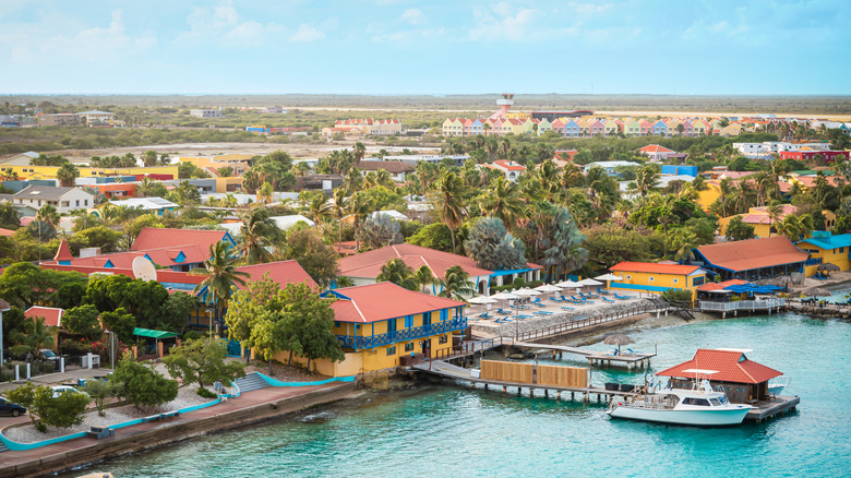 Kralendijk harbor in Bonaire with colorful buildings and a dock