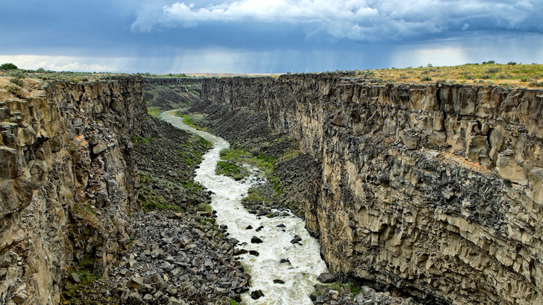 Malad Gorge in Southern Idaho with rain clouds in the distance