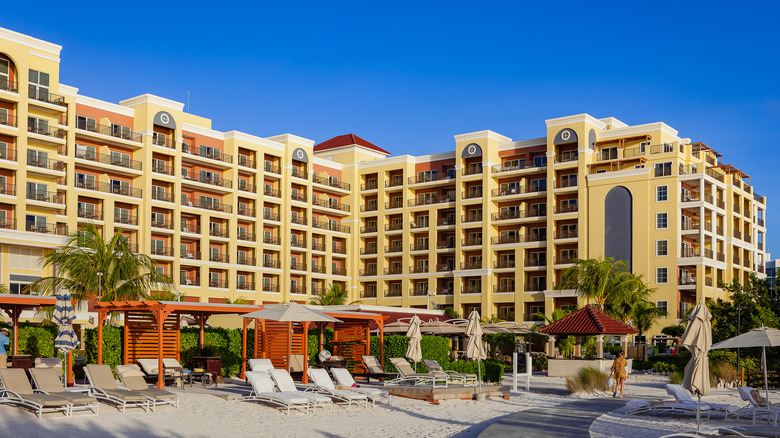 View of the yellow facade of the Ritz-Carlton, Aruba from the beach