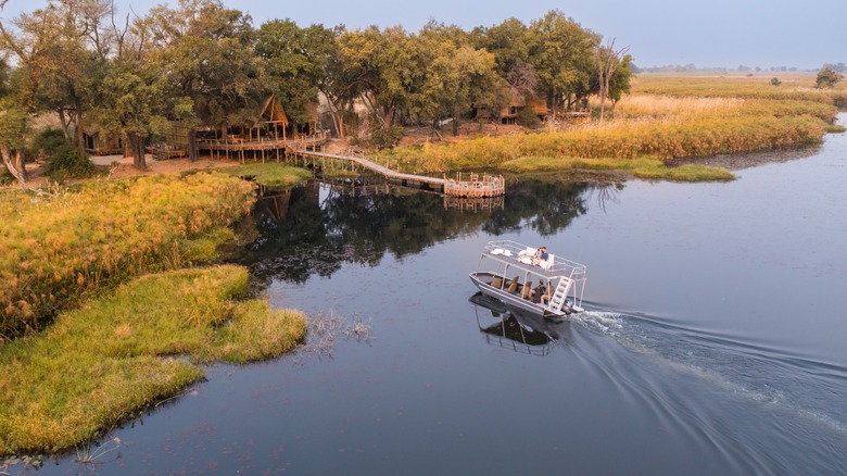 Boat traveling to the main lodge of Sitatunga Private Island