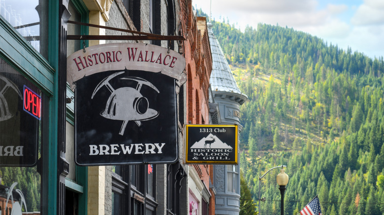 Signs hanging from buildings in downtown Wallace