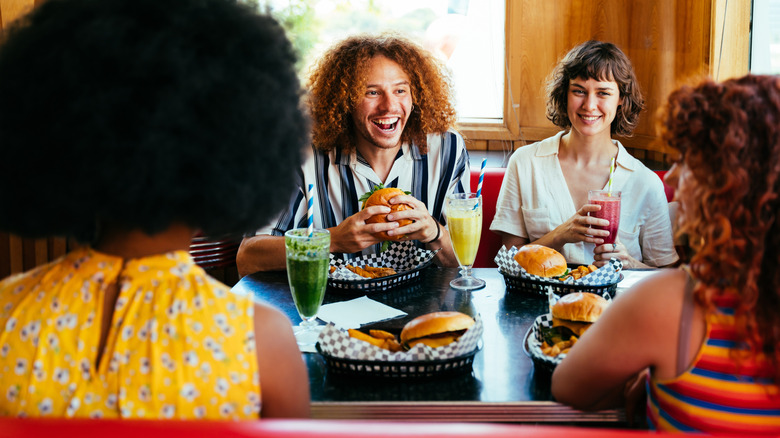 Friends eating together at a restaurant