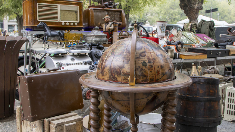 An assortment of antiques, inluding a wood globe.