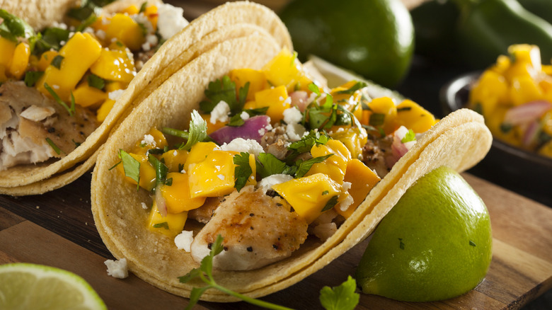 fish tacos with mango and red onion