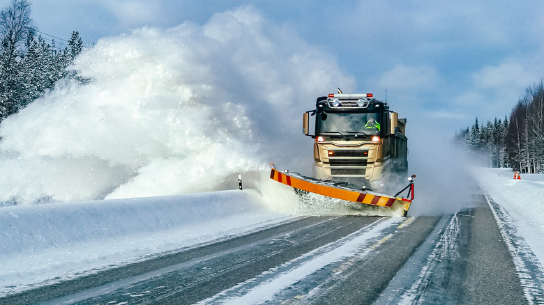 Snow plow on snowy Finnish street