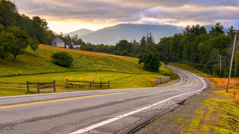 Road going through Jefferson, New Hampshire with the mountains in the background