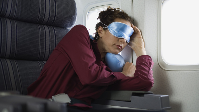 Woman sleeping inside a plane