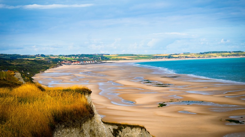 Golden sands and grass with pools of water along the Pas de Calais coast