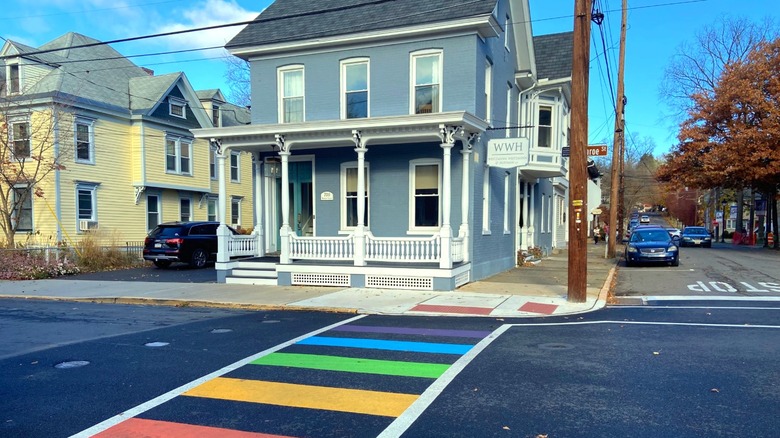 Rainbow crosswalk in front of historic downtown Stroudsburg building