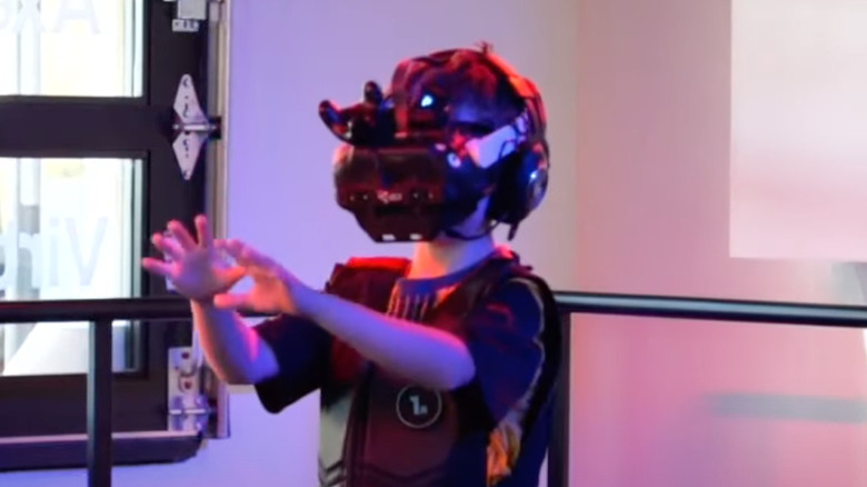 Child playing with VR headset