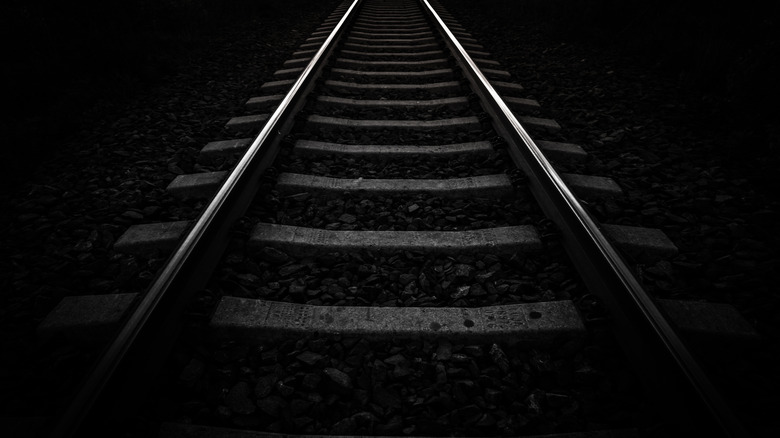 A dark railroad track