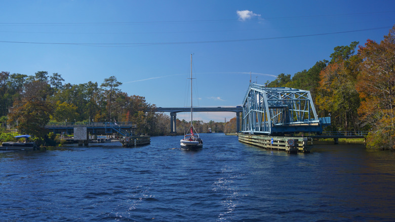 A sailboat passes through an ICW swing bridge in South Carolina