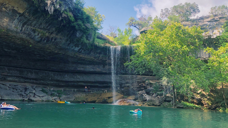 People floating in Hamilton Pool Preserve