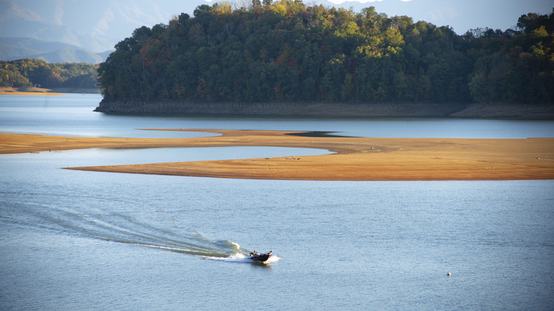 Boats and low-tide shores in Douglas Lake in Tennessee