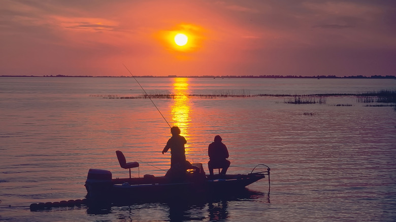 people fishing in Lake Okeechobee at sunset